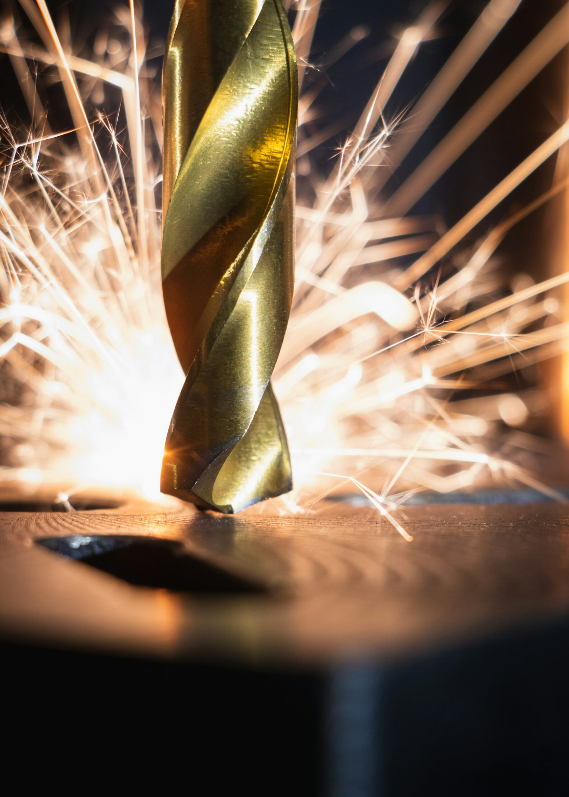 drill-bit-sparks drill bit going into metal with sparks flying