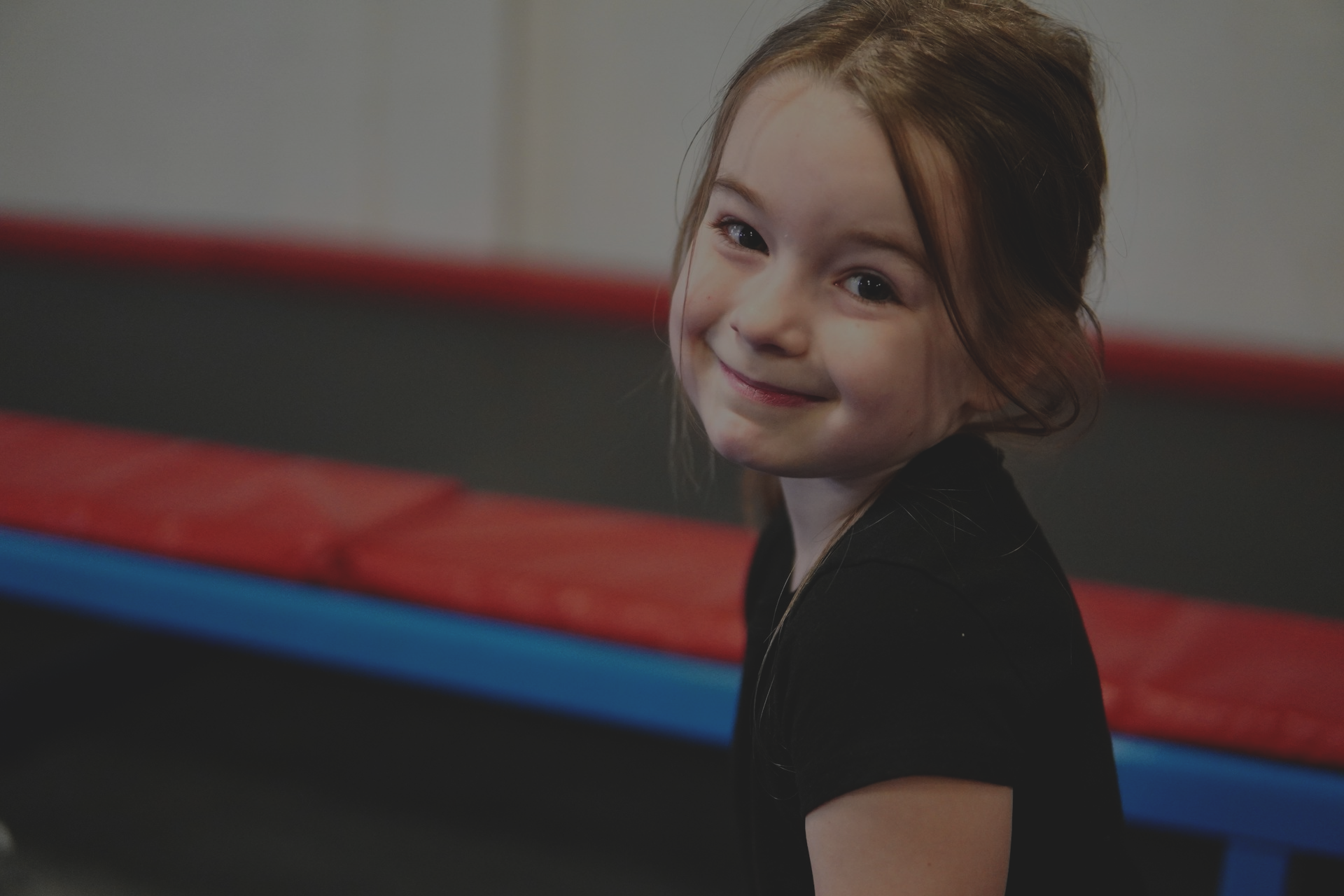 young child in indoor trampoline park